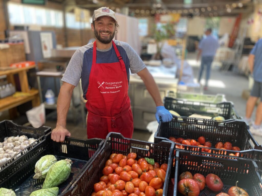 Farmer and produce at Cooperstown Farmers' Market 